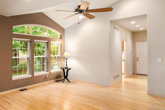3231 Oak St, Wheat Ridge, CO 80033 - empty room featuring wood finished floors, ceiling fan, and high vaulted ceiling