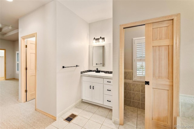 3231 Oak St, Wheat Ridge, CO 80033 - bathroom with vanity and tile patterned floors