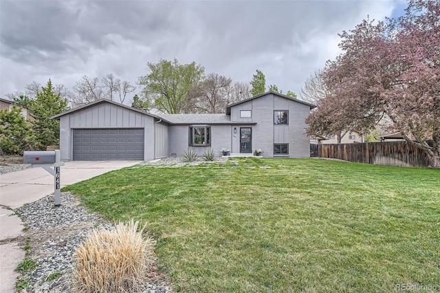 1641 S Parfet Ct, Denver, CO 80232 - view of front facade with a garage, fence, a front yard, brick siding, and driveway