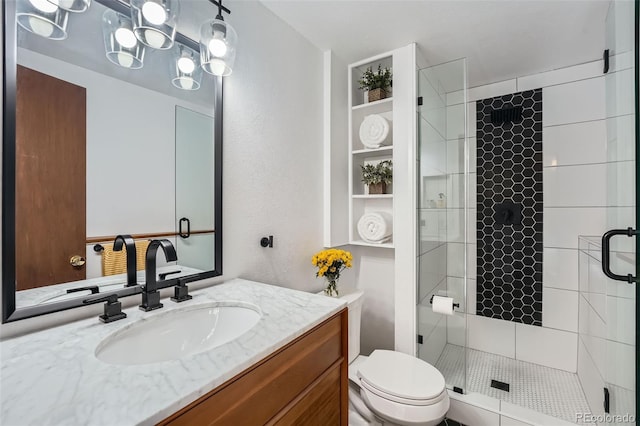 1641 S Parfet Ct, Denver, CO 80232 - full bath featuring vanity, toilet, and a shower stall