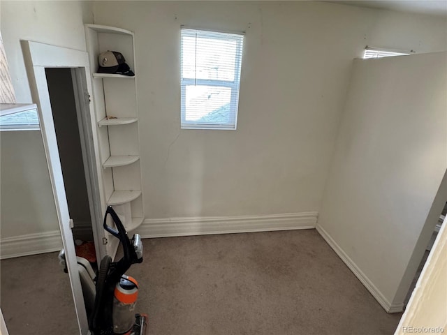 interior space featuring baseboards