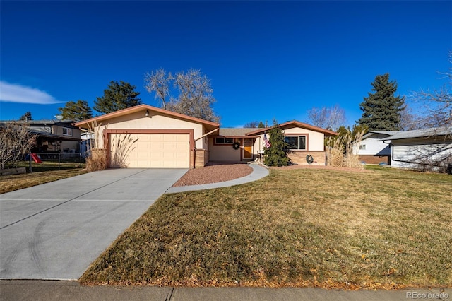 ranch-style home featuring a front lawn and a garage