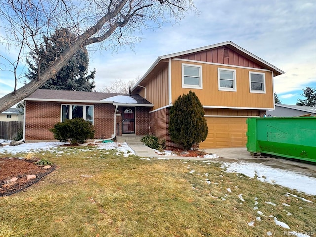 split level home featuring a garage and a front yard