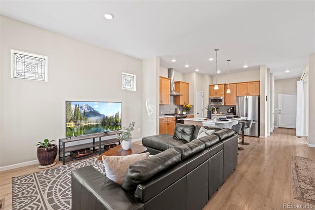 48 Mayflower Park Pl, Colorado Springs, CO 80905 - living room with light wood-style flooring and recessed lighting