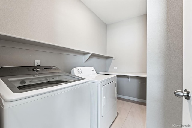48 Mayflower Park Pl, Colorado Springs, CO 80905 - laundry room with washer and dryer and light tile patterned floors