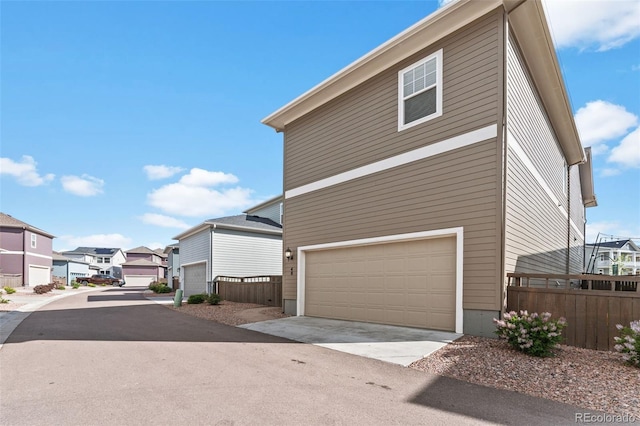 48 Mayflower Park Pl, Colorado Springs, CO 80905 - view of side of property with a residential view and a garage
