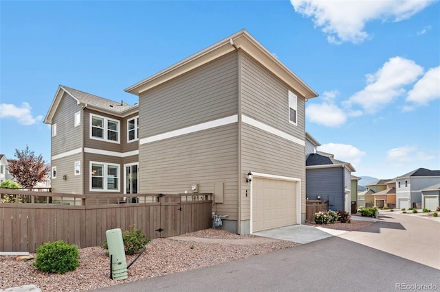 48 Mayflower Park Pl, Colorado Springs, CO 80905 - view of side of property with driveway, a garage, and a residential view