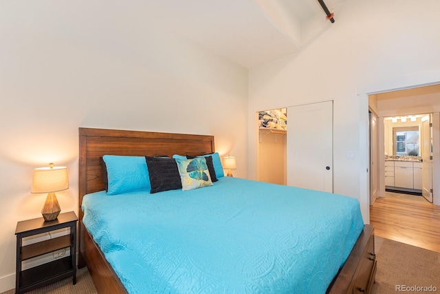 824 Grand Ave Unit 4, Grand Lake, CO 80447 - carpeted bedroom featuring a closet, lofted ceiling, and wood finished floors