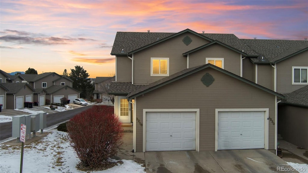 front of property with a garage