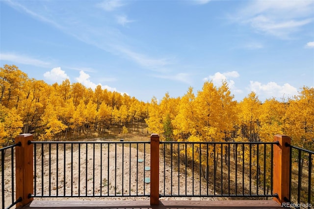 exterior space featuring a wooded view