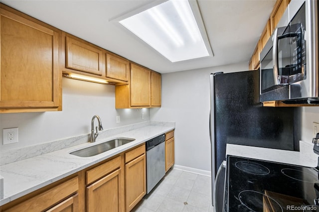 7825 Barbara Ann Dr Unit I, Arvada, CO 80004 - kitchen featuring stainless steel appliances, light stone countertops, brown cabinets, and light tile patterned flooring