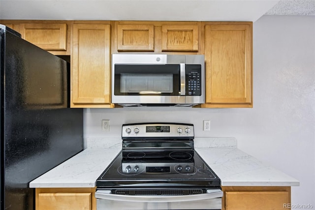 7825 Barbara Ann Dr Unit I, Arvada, CO 80004 - kitchen featuring stainless steel appliances