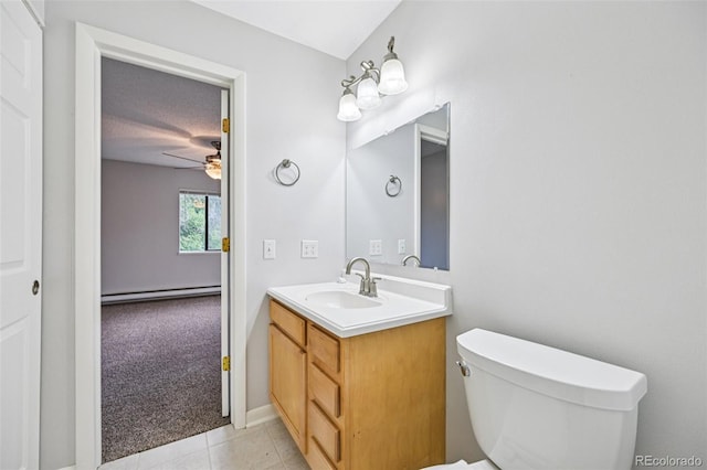 7825 Barbara Ann Dr Unit I, Arvada, CO 80004 - half bath with a baseboard radiator, vanity, ceiling fan, and tile patterned flooring
