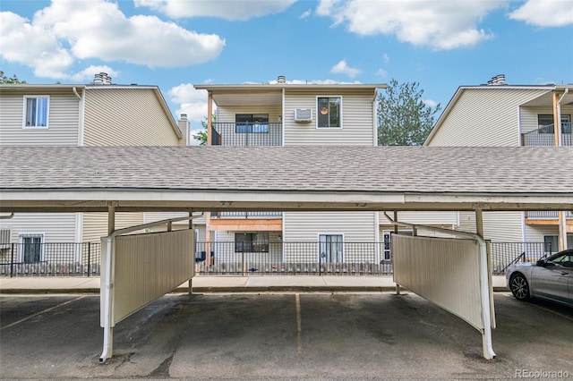 7825 Barbara Ann Dr Unit I, Arvada, CO 80004 - back of property featuring covered parking and roof with shingles