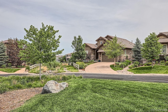 view of front of home featuring a garage and a front yard