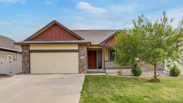5770 Waverley Ave, Firestone, CO 80504 - view of front of property with board and batten siding, stone siding, a porch, and an attached garage