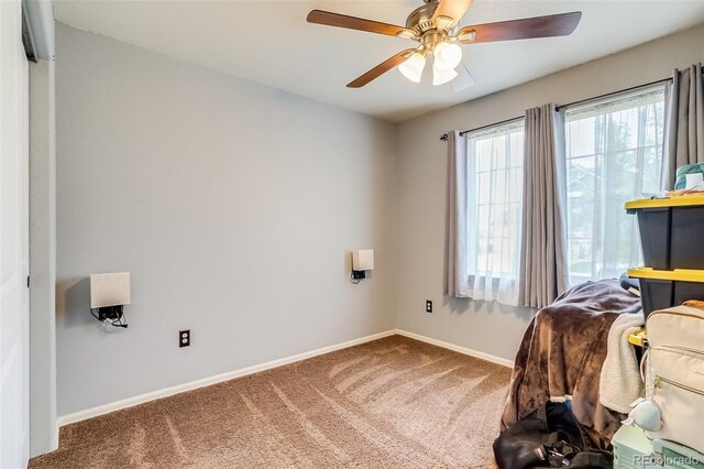 5770 Waverley Ave, Firestone, CO 80504 - carpeted bedroom with baseboards and ceiling fan