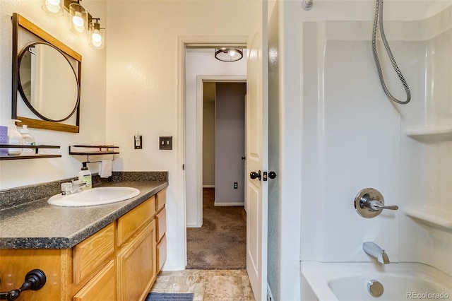 5770 Waverley Ave, Firestone, CO 80504 - bathroom with washtub / shower combination, vanity, and baseboards