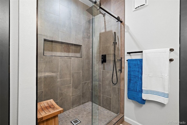 84 Spruce St Unit 707, Denver, CO 80230 - bathroom featuring a shower stall and baseboards