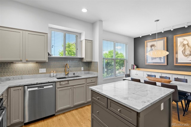 84 Spruce St Unit 707, Denver, CO 80230 - kitchen featuring stainless steel dishwasher, gray cabinets, a sink, track lighting, and light wood-style flooring