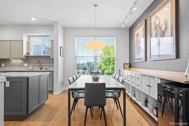 84 Spruce St Unit 707, Denver, CO 80230 - dining area featuring light wood-type flooring and rail lighting
