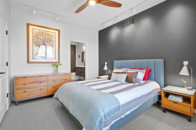 84 Spruce St Unit 707, Denver, CO 80230 - bedroom featuring track lighting, carpet floors, connected bathroom, and a ceiling fan