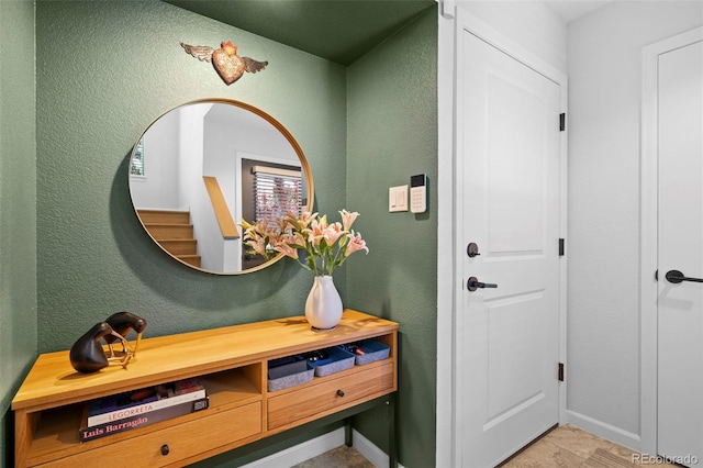 84 Spruce St Unit 707, Denver, CO 80230 - entryway with a textured wall, baseboards, and stairway