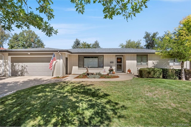 single story home with a garage and a front lawn