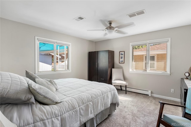 bedroom featuring carpet flooring, ceiling fan, and baseboard heating