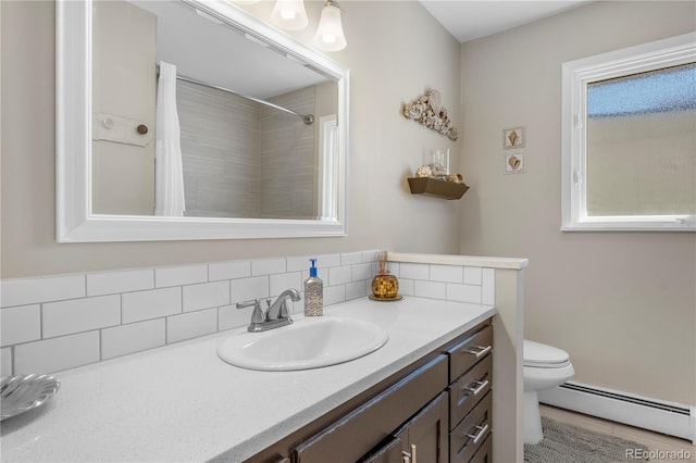 bathroom featuring baseboard heating, vanity, toilet, and hardwood / wood-style floors