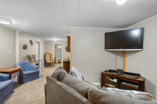 carpeted living room with ornamental molding