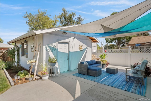 view of patio / terrace with an outbuilding and an outdoor hangout area