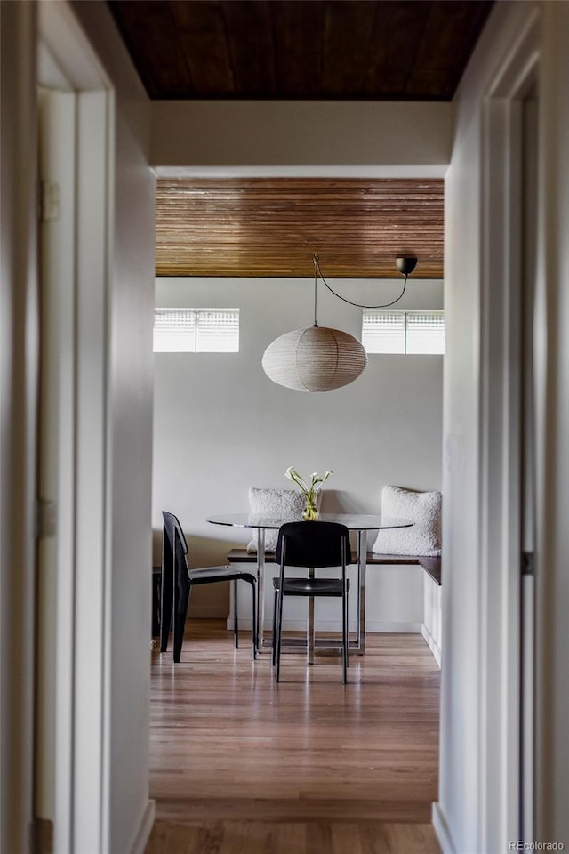 dining room with breakfast area and wood finished floors