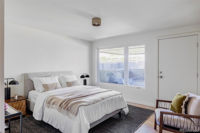 bedroom featuring wood finished floors