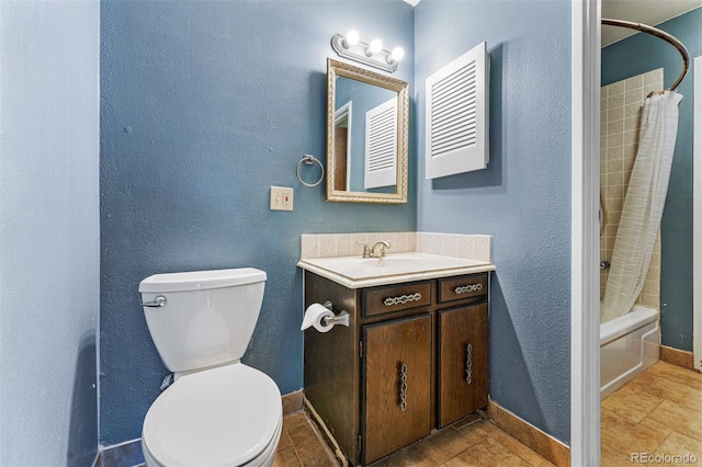 full bathroom featuring tile patterned floors, vanity, toilet, and shower / tub combo with curtain