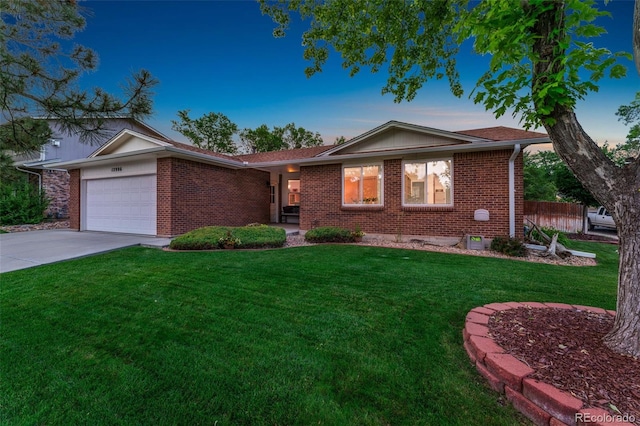 12906 Cherry Way, Thornton, CO 80241 - ranch-style home with brick siding, an attached garage, and driveway