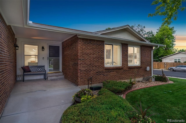 12906 Cherry Way, Thornton, CO 80241 - property exterior at dusk featuring brick siding