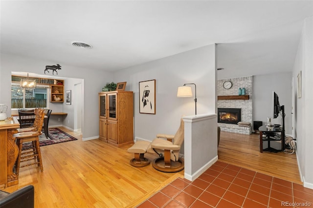 12906 Cherry Way, Thornton, CO 80241 - living room featuring wood finished floors and a fireplace