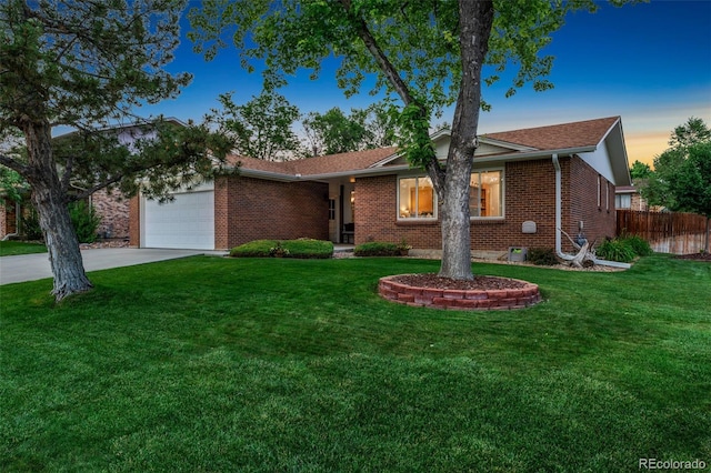 12906 Cherry Way, Thornton, CO 80241 - ranch-style home with brick siding, concrete driveway, and an attached garage