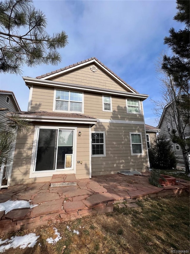 rear view of house featuring a patio area