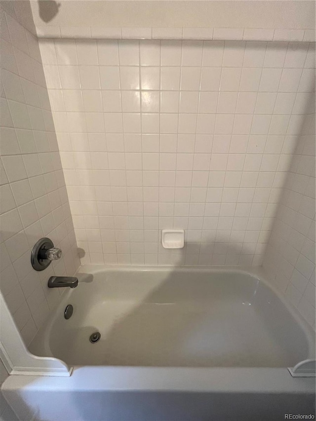 full bath featuring shower / bathtub combination