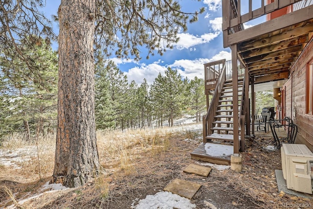 view of yard featuring stairs and ac unit