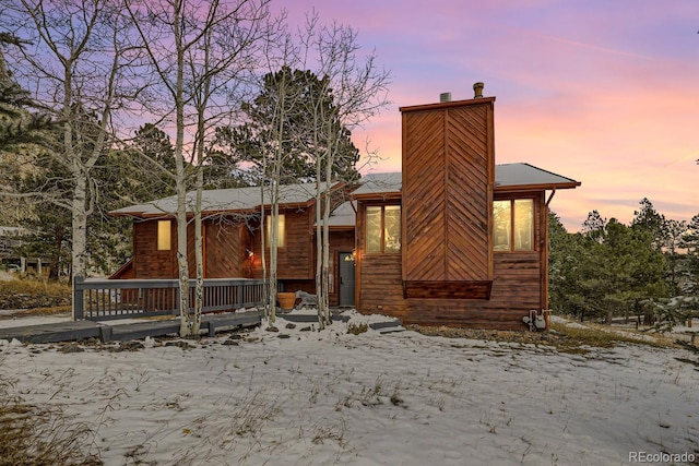 view of front of home with a chimney