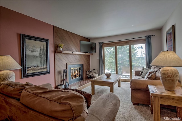 94300 Ryan Gulch Rd Unit 301, Silverthorne, CO 80498 - living room featuring carpet flooring, a large fireplace, and wooden walls