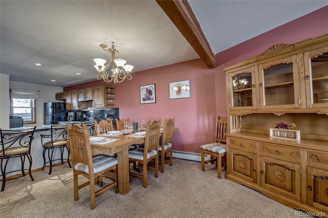 94300 Ryan Gulch Rd Unit 301, Silverthorne, CO 80498 - dining area with a baseboard radiator, a chandelier, light carpet, baseboards, and recessed lighting