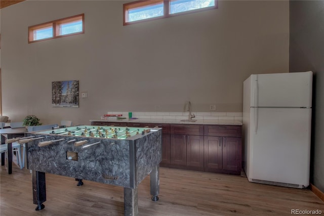 94300 Ryan Gulch Rd Unit 301, Silverthorne, CO 80498 - rec room with healthy amount of natural light, light wood-style floors, and a sink