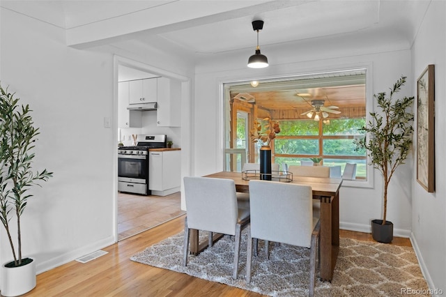 6755 W 45th Ave, Wheat Ridge, CO 80033 - dining room with light wood finished floors and a ceiling fan