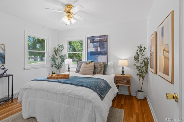 6755 W 45th Ave, Wheat Ridge, CO 80033 - bedroom featuring wood finished floors and a ceiling fan