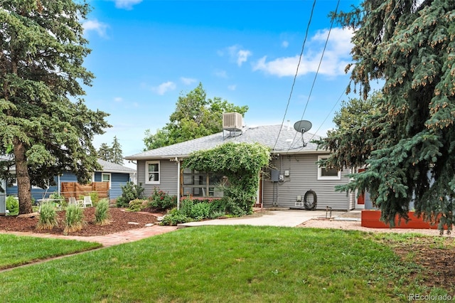 6755 W 45th Ave, Wheat Ridge, CO 80033 - rear view of house featuring a yard and a patio