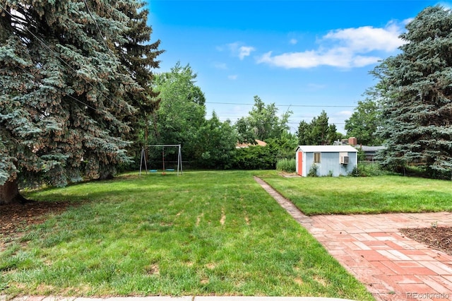 6755 W 45th Ave, Wheat Ridge, CO 80033 - view of green lawn featuring a shed